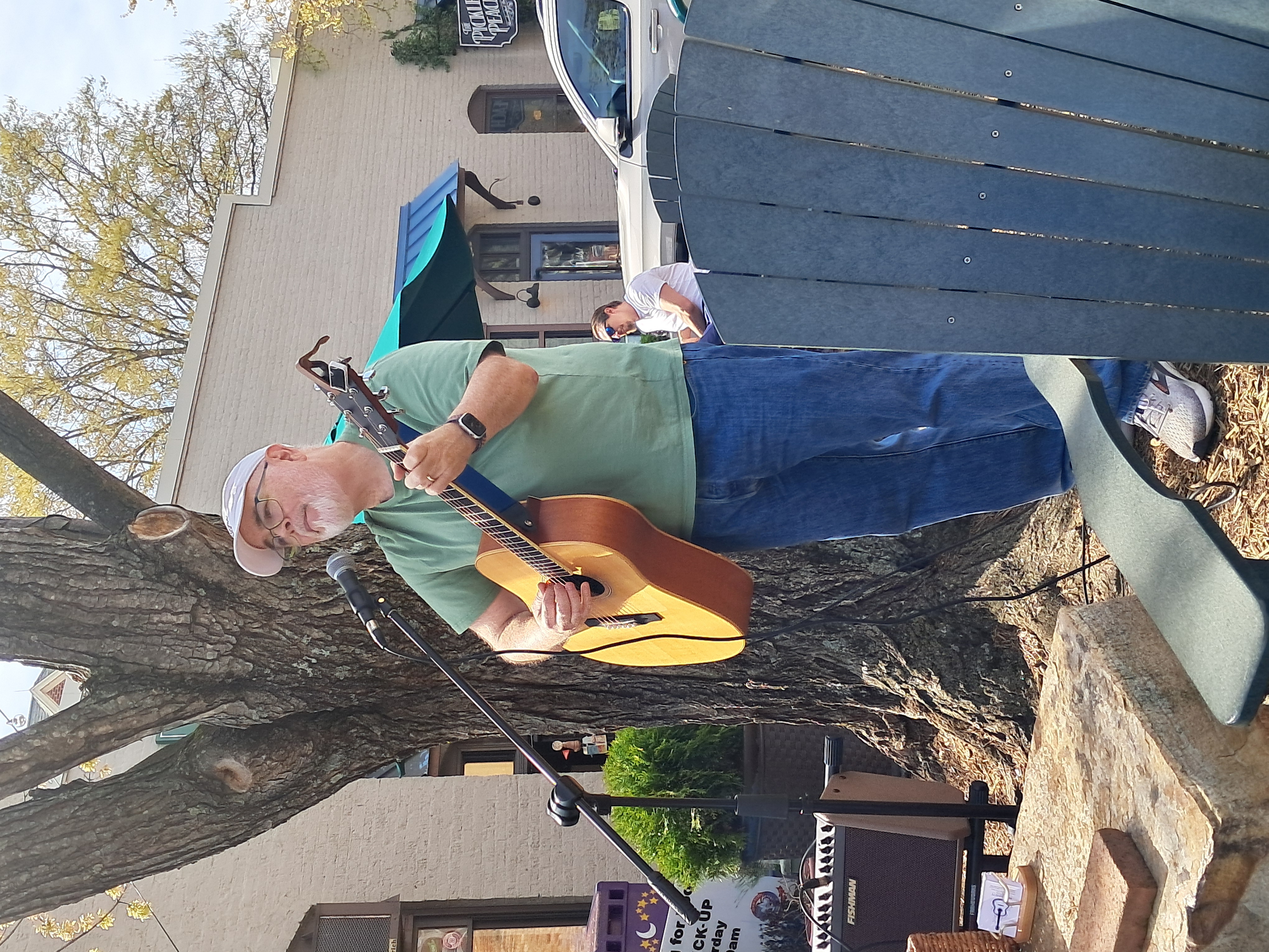 Bill Barnett performing for an outdoor audience